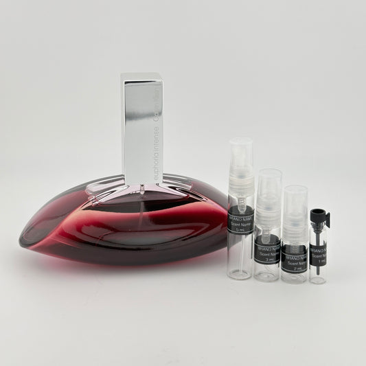Red wine decanter with small bottles on a white background