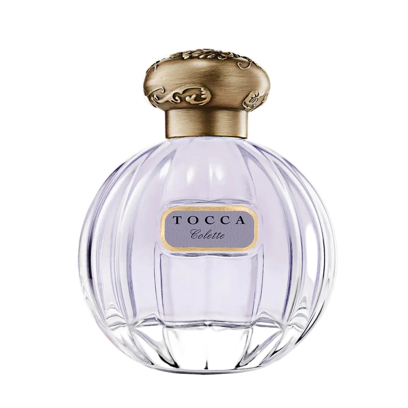 Tocca perfume bottle with gold cap on a light gray background