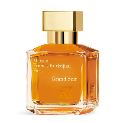 Perfume bottle with gold cap and orange liquid on a white background